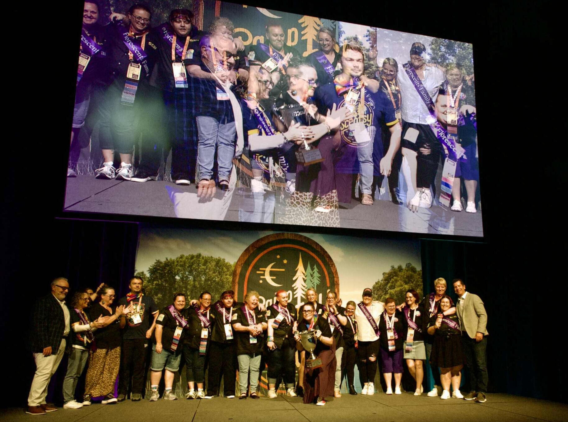 Best Dressed Team at Scentsy Family Reunion 2025 Liane with fellow Scentsy Consultants on stage after winning Best Dressed Team at Scentsy Family Reunion 2025