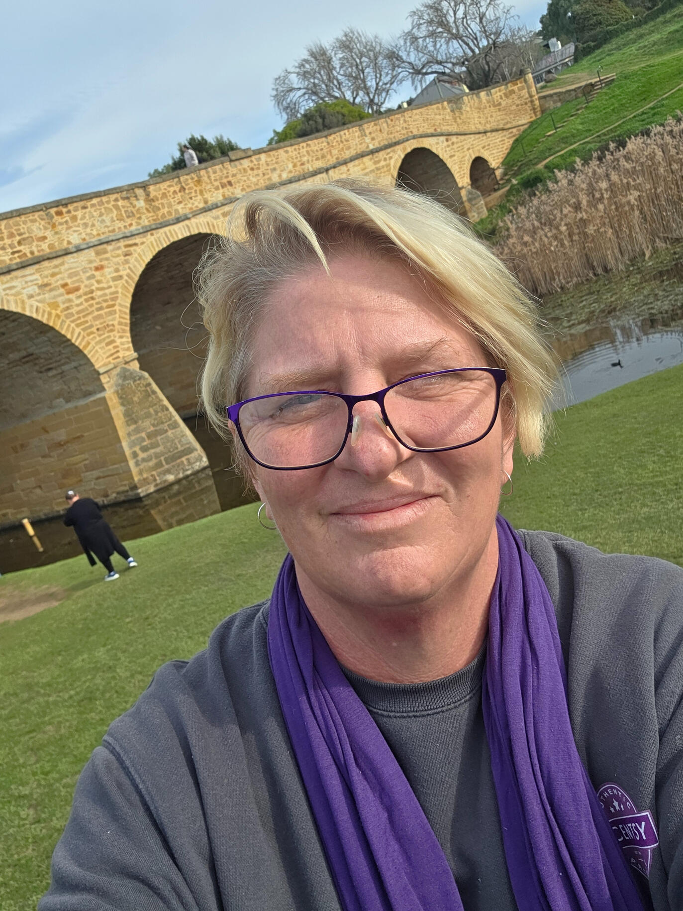 Liane smiling outdoors in Tasmania during a March 2026 trip with friends from her Scentsy community